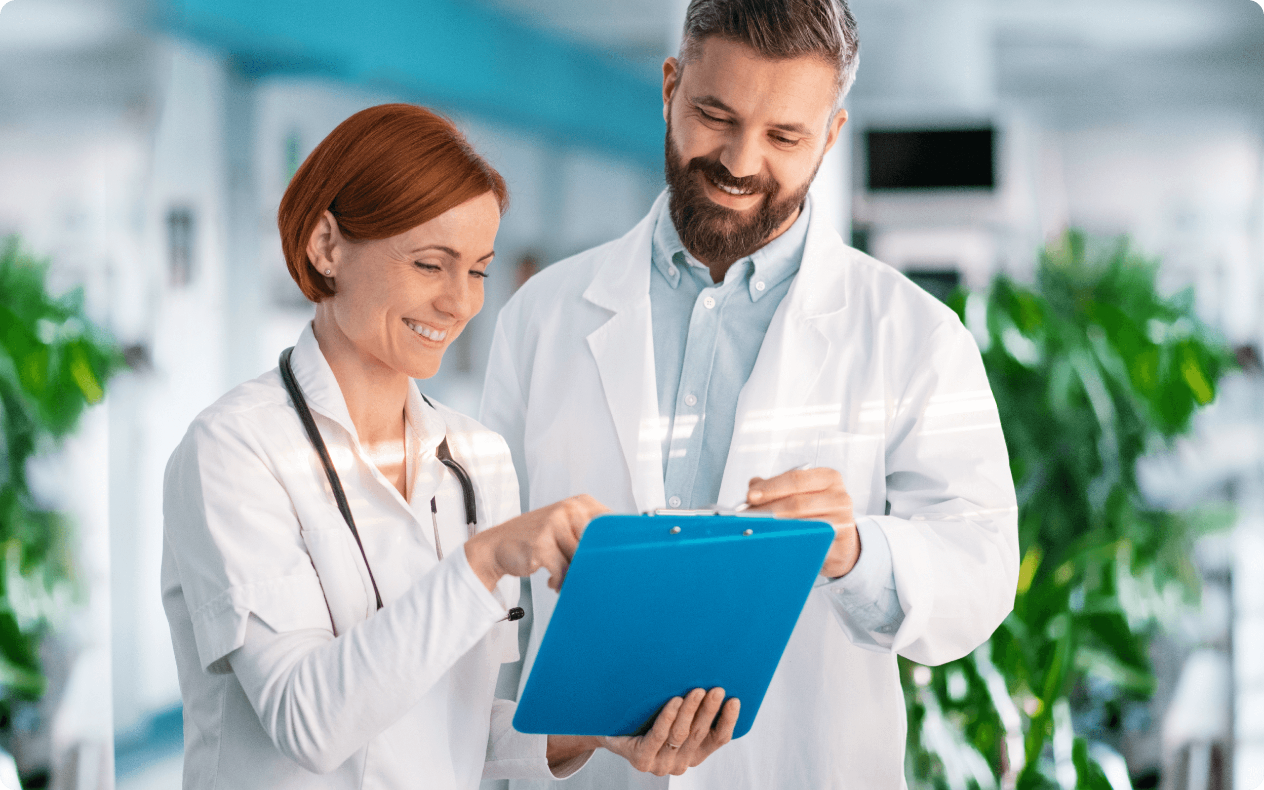 Two doctors looking at a medical card